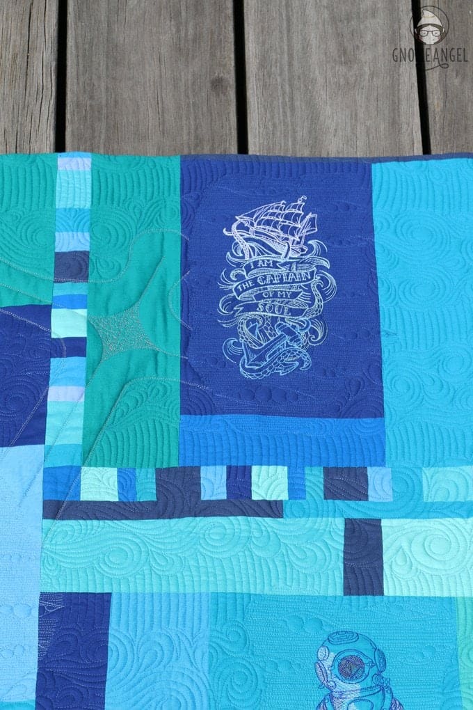 "Son of a Son of a Sailor" - Designed, embroidered and pieced by Angie Wilson of www.GnomeAngel.com using Robert Kaufman Kona and Urban Threads Embroidery Patterns. Custom quilted by Raylee Bielenberg of Sunflower Quilting | Find out more at www.GnomeAngel.com
