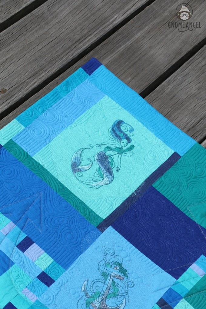 "Son of a Son of a Sailor" - Designed, embroidered and pieced by Angie Wilson of www.GnomeAngel.com using Robert Kaufman Kona and Urban Threads Embroidery Patterns. Custom quilted by Raylee Bielenberg of Sunflower Quilting | Find out more at www.GnomeAngel.com
