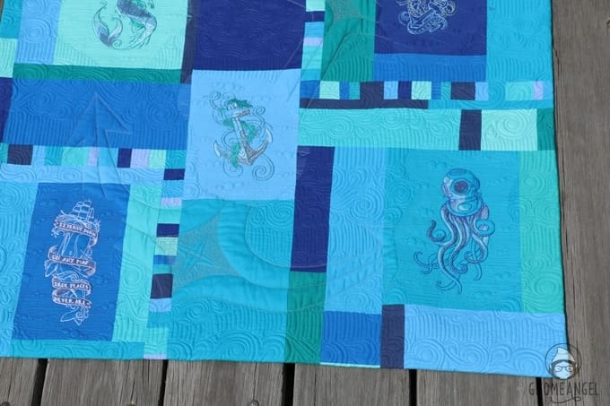 "Son of a Son of a Sailor" - Designed, embroidered and pieced by Angie Wilson of www.GnomeAngel.com using Robert Kaufman Kona and Urban Threads Embroidery Patterns. Custom quilted by Raylee Bielenberg of Sunflower Quilting | Find out more at www.GnomeAngel.com