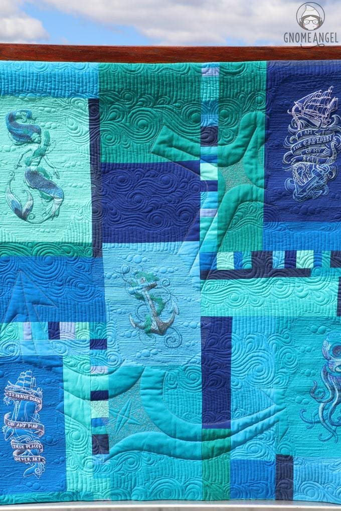 "Son of a Son of a Sailor" - Designed, embroidered and pieced by Angie Wilson of www.GnomeAngel.com using Robert Kaufman Kona and Urban Threads Embroidery Patterns. Custom quilted by Raylee Bielenberg of Sunflower Quilting | Find out more at www.GnomeAngel.com