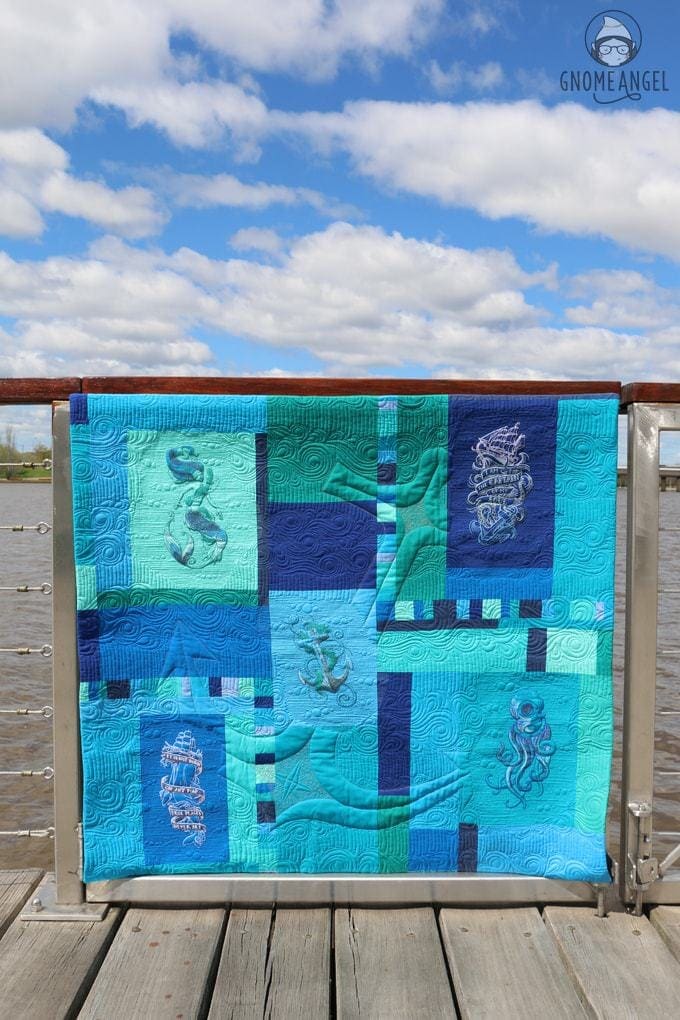 "Son of a Son of a Sailor" - Designed, embroidered and pieced by Angie Wilson of www.GnomeAngel.com using Robert Kaufman Kona and Urban Threads Embroidery Patterns. Custom quilted by Raylee Bielenberg of Sunflower Quilting | Find out more at www.GnomeAngel.com