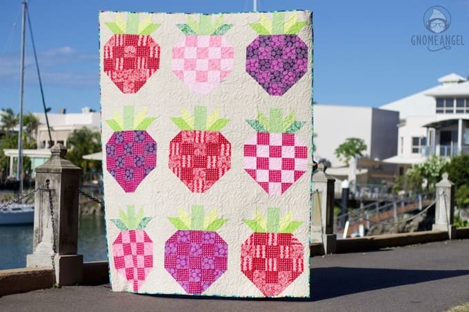 Strawberry Fields - Upscaled strawberry block based on Bec Skyberries strawberry block tutorial. Quilt made with Blueberry Park and Essex Linen by Robert Kaufman. Quilted by Raylee Bielenberg of Sunflower Quilting. Find out more on www.GnomeAngel.com