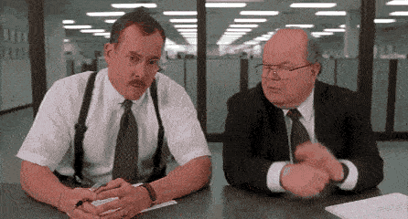 Two office workers asking "What would you say you do here?"
